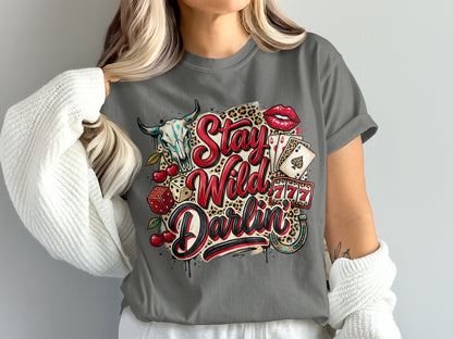 T-shirt with "Stay Wild Darlin'" text, bull skull, cherries, dice, cards, and lips.