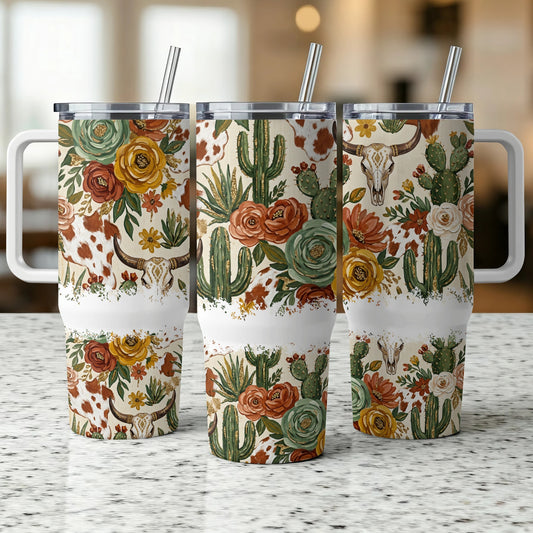 Floral and cactus pattern tumbler with cow skull design.