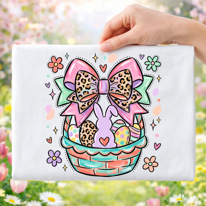 Easter basket with bunny, colorful eggs, and floral bow.