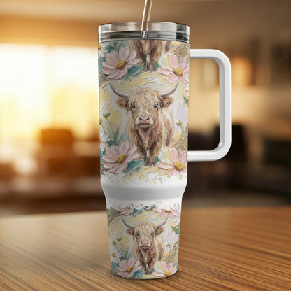 Highland cow and floral design on insulated tumbler with handle.