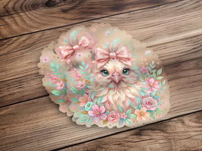 Charming, fluffy chick with pastel floral accents and pink bows.