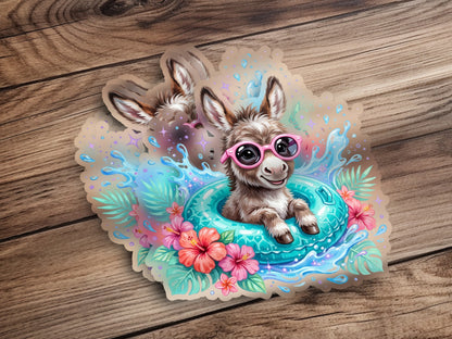 Cartoon donkey with pink sunglasses floats in a turquoise inner tube surrounded by tropical flowers.