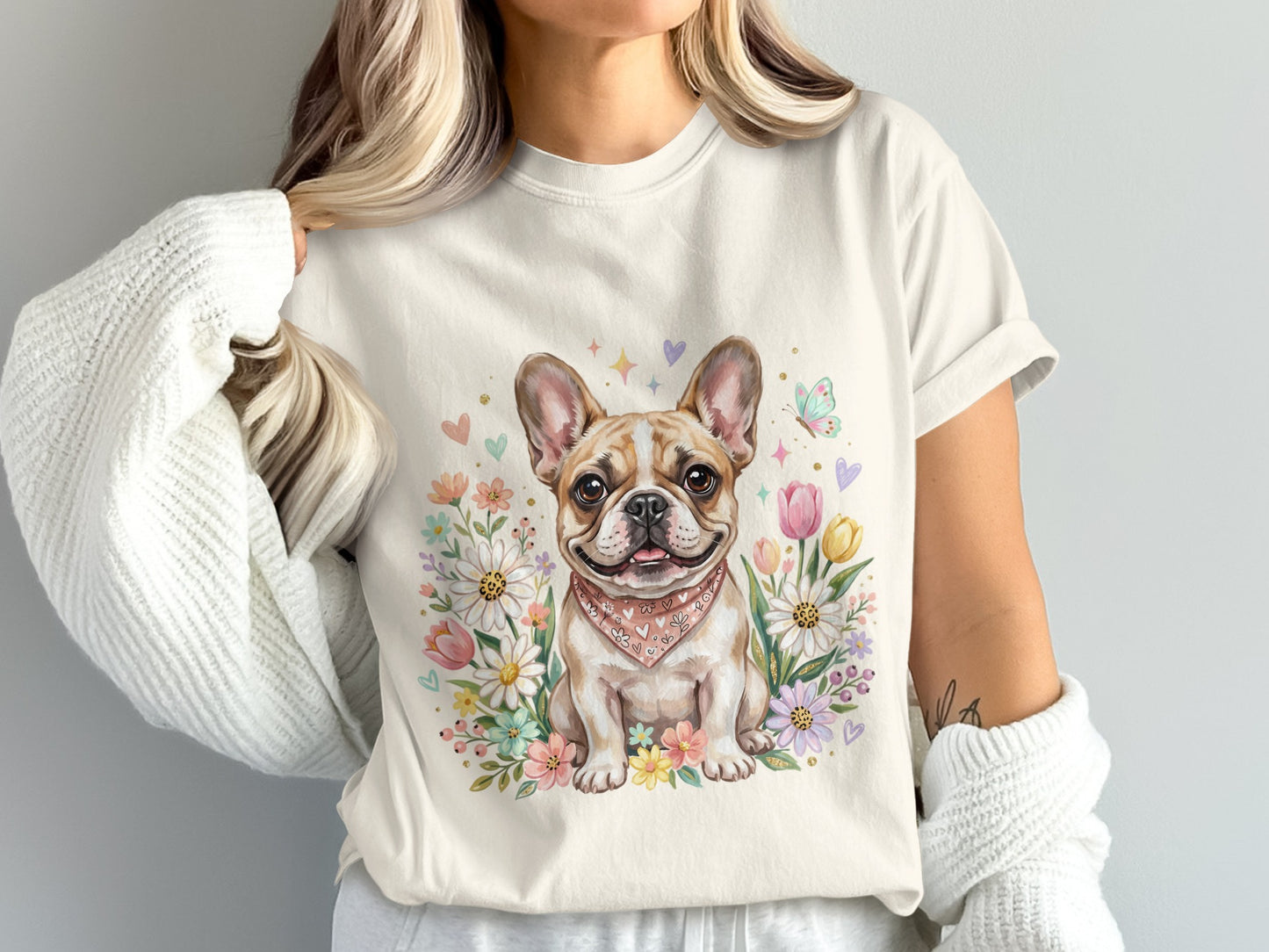 French bulldog with floral accents and bandana on a light t-shirt.