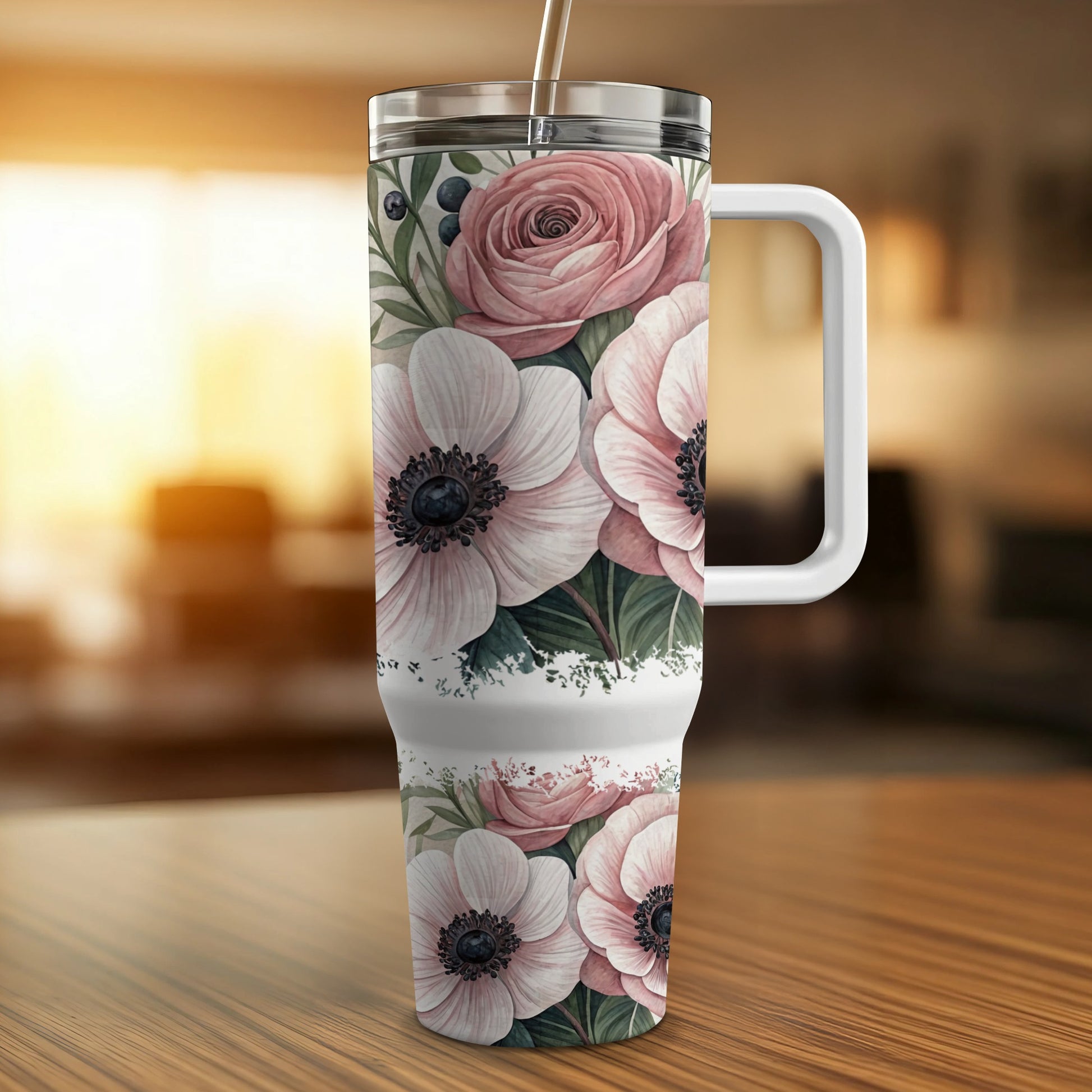 Floral anemone and rose print tumbler with white handle.