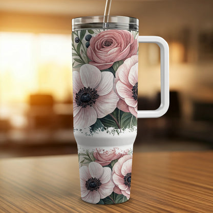 Floral anemone and rose print tumbler with white handle.