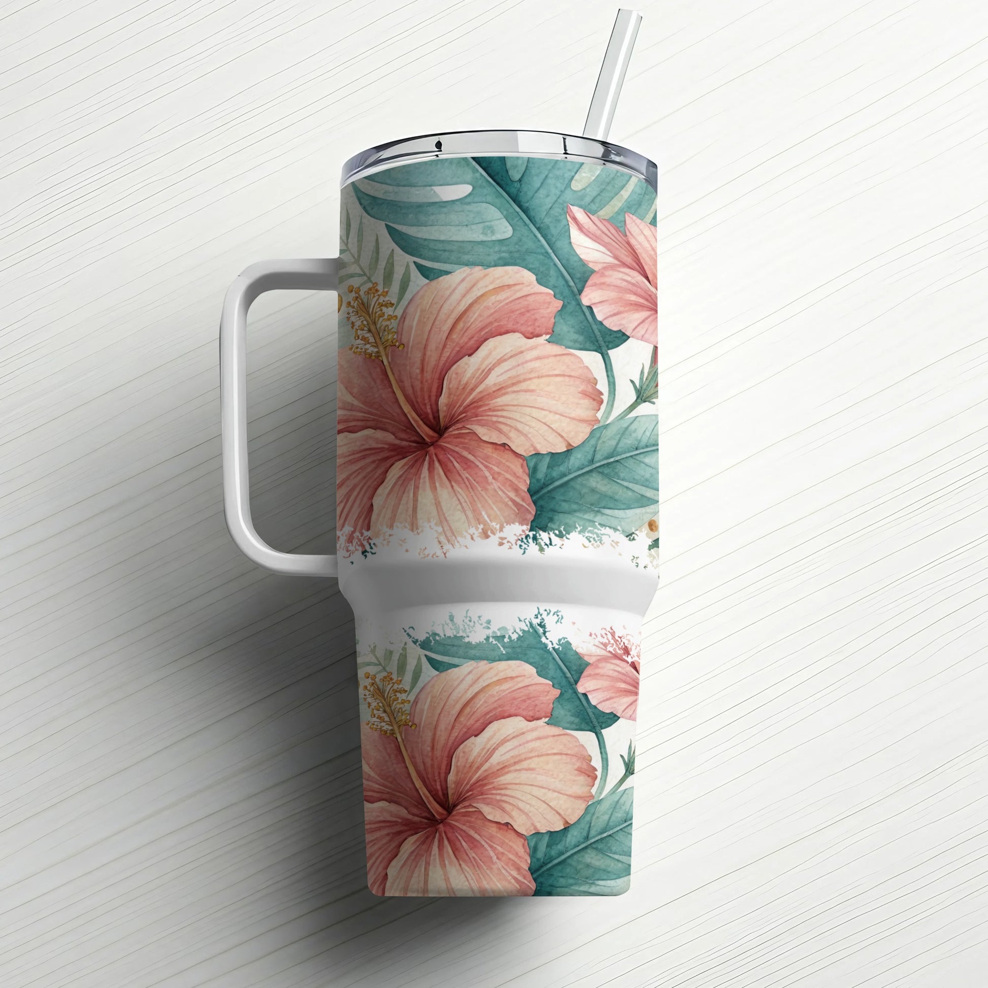 White tumbler with hibiscus flowers and leaves, featuring a straw.