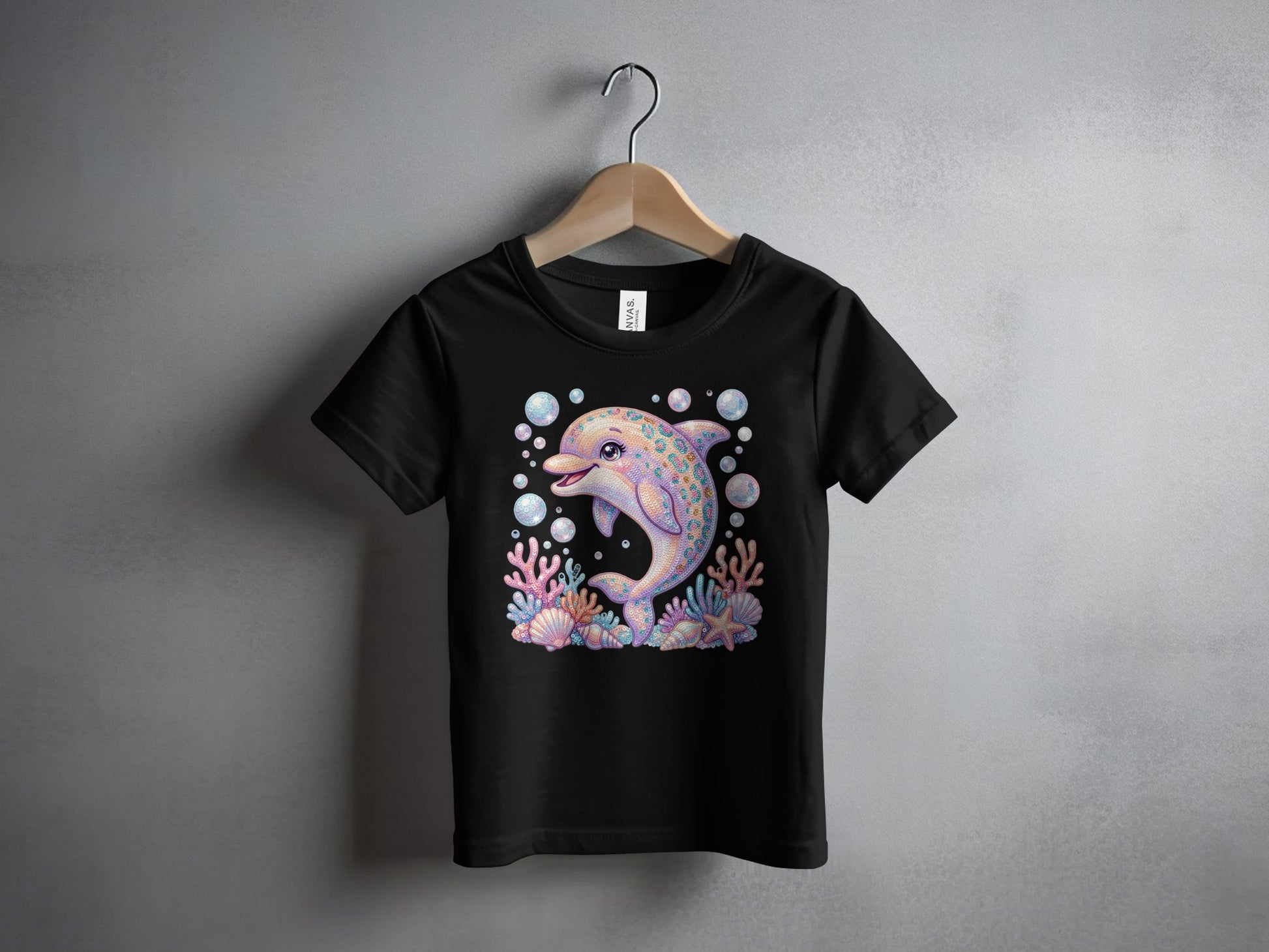 Black t-shirt with a colorful cartoon dolphin surrounded by seashells and bubbles.