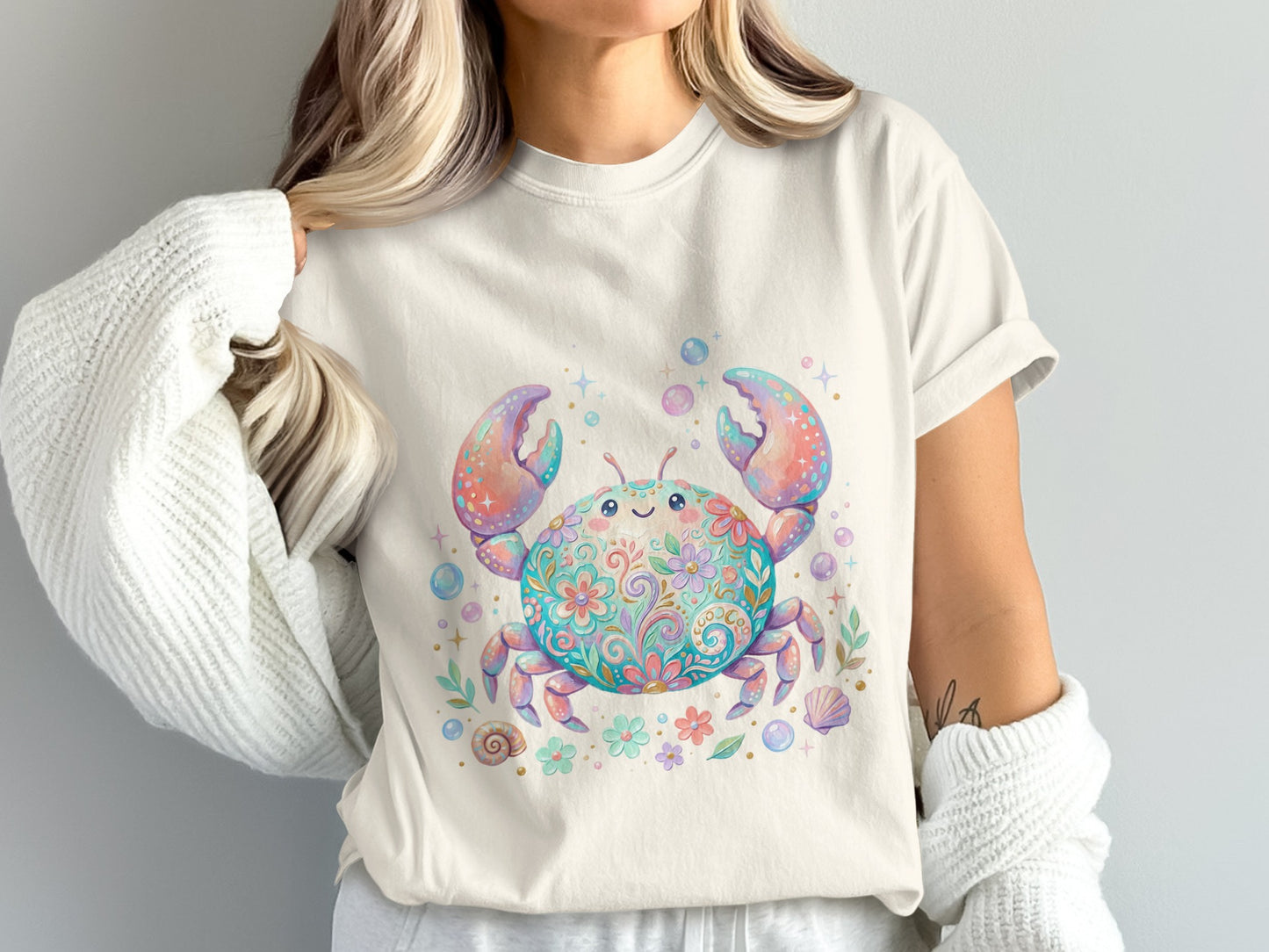 Cream t-shirt with colorful watercolor crab and floral design.
