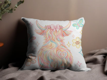 Watercolor Highland cow with butterflies and flowers on a decorative throw pillow.
