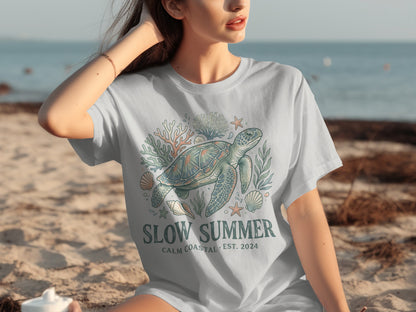 T-shirt with a sea turtle, coral, and shells design.