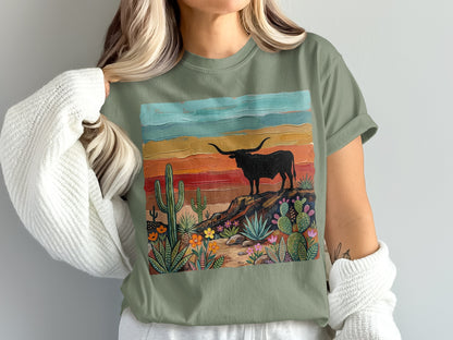 T-shirt featuring a stylized desert landscape with a longhorn silhouette.