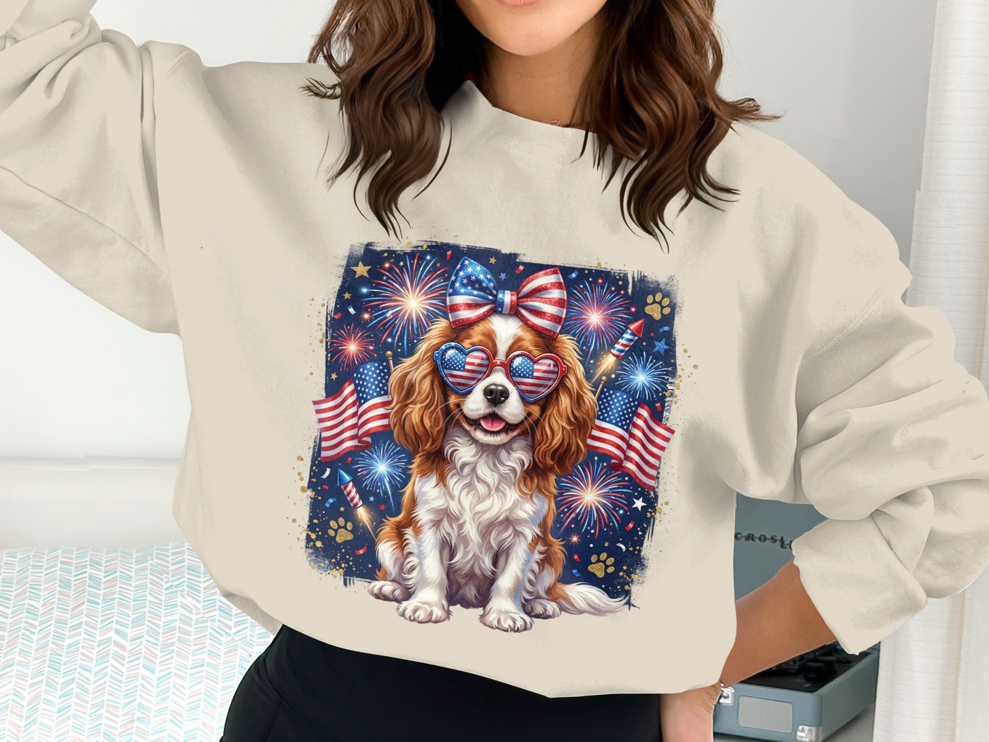 Woman wearing patriotic sweatshirt with dog and fireworks graphic.