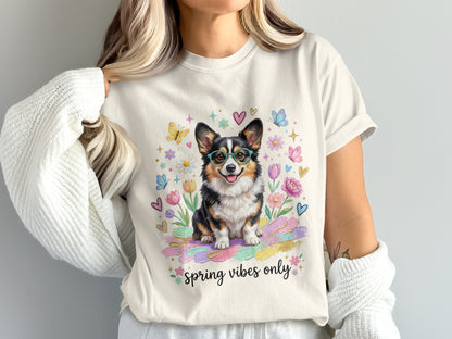 Corgi wearing glasses surrounded by colorful flowers and butterflies, text "spring vibes only".