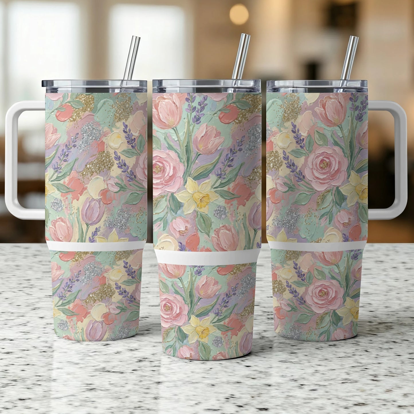 Three tumblers with pastel floral pattern and silver straws.