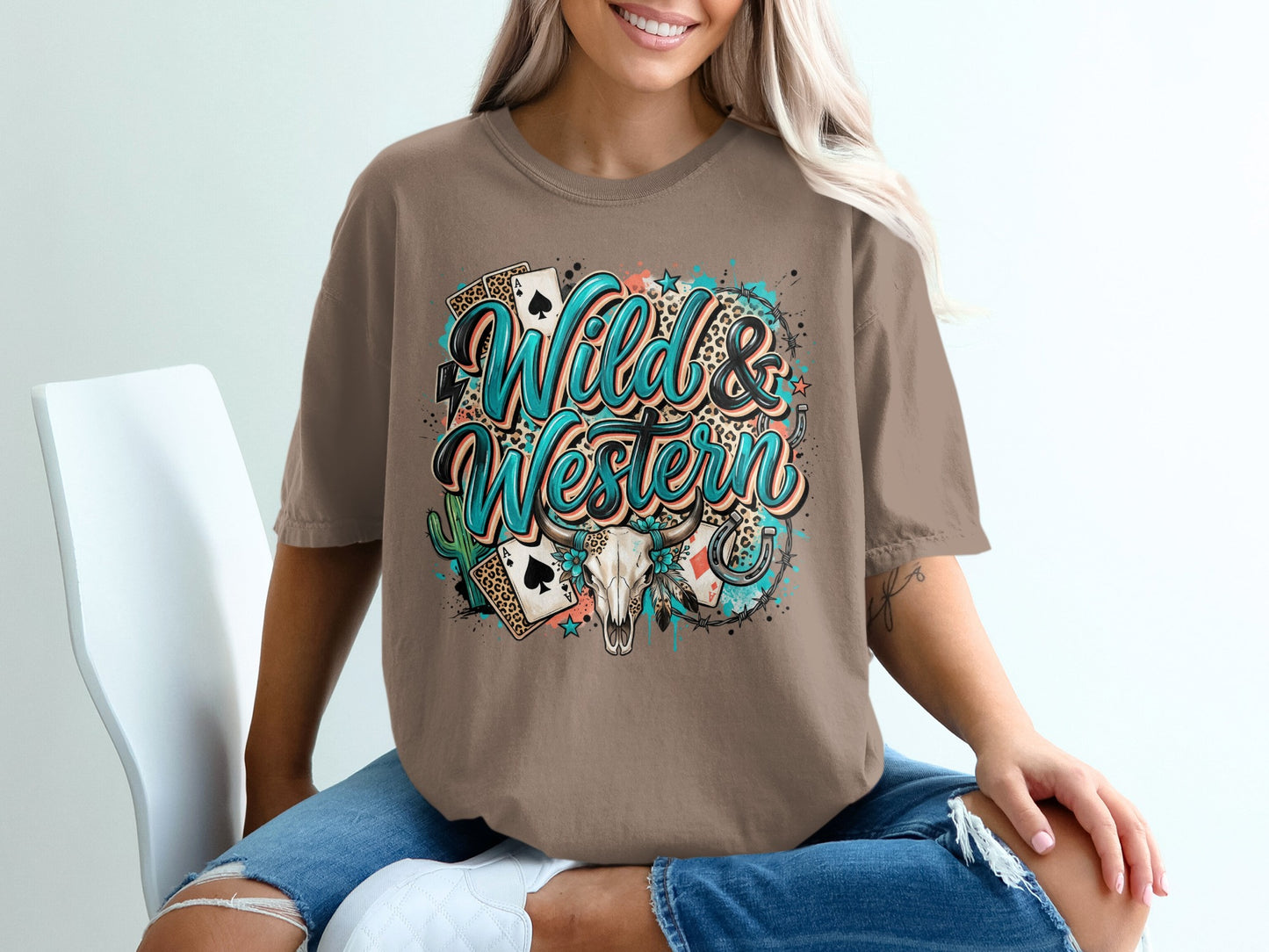 Brown t-shirt with "Wild & Western" text, playing cards, skull, and stars.