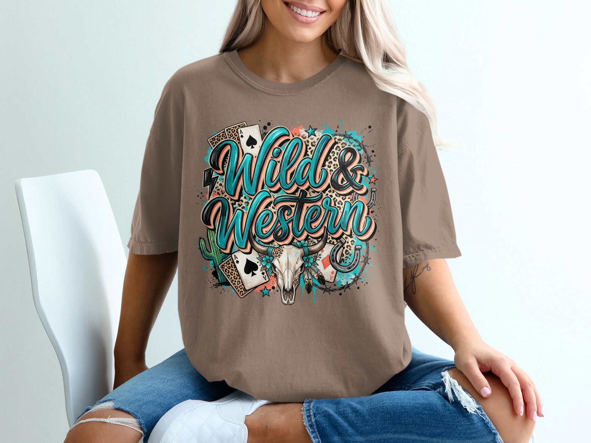 Brown t-shirt with "Wild & Western" text, playing cards, skull, and stars.