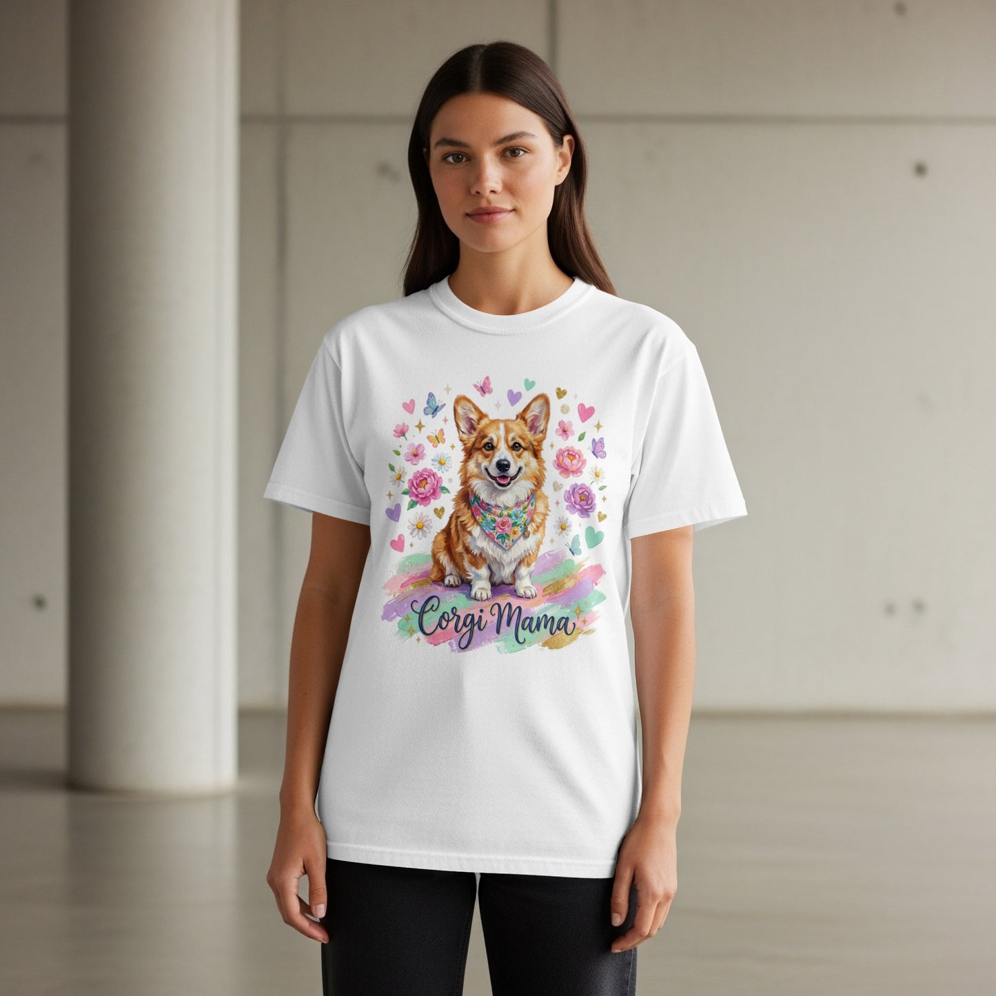 White t-shirt with a watercolor corgi wearing a floral bandana, butterflies, and "Corgi Mama" text.