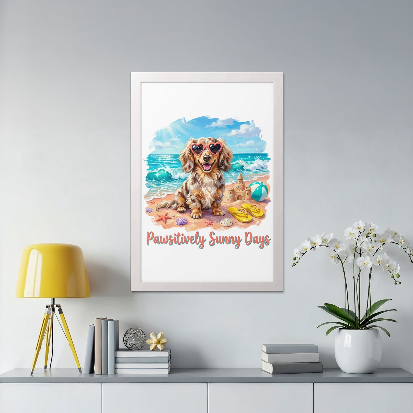 Dachshund wearing heart sunglasses on a beach with "Pawsitively Sunny Days" text.