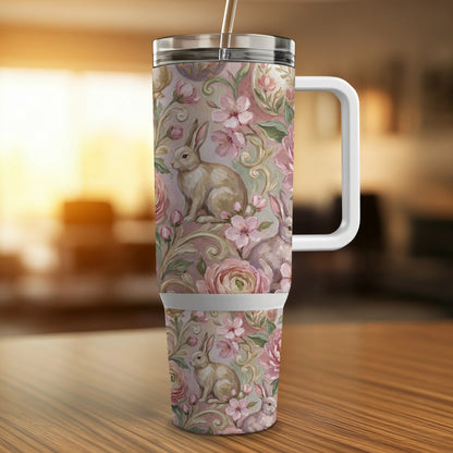 Floral bunny tumbler with handle and straw, soft pastel colors.