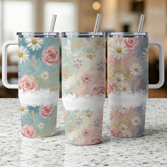 Three tumblers with floral and paw print designs in pastel colors.