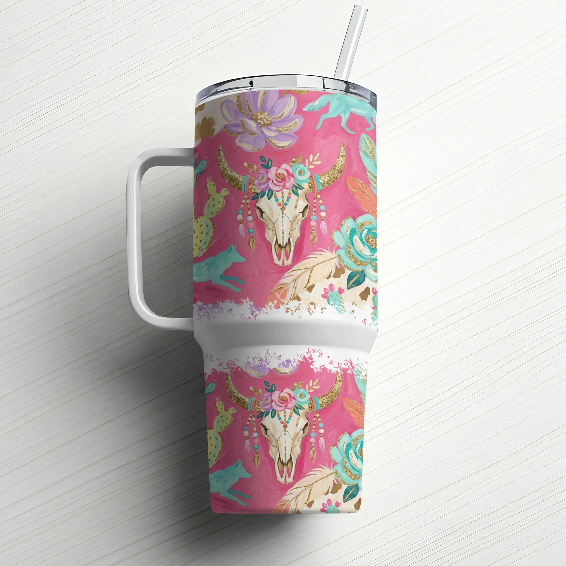 Boho-inspired tumbler with bull skull, cactus, and feather design.