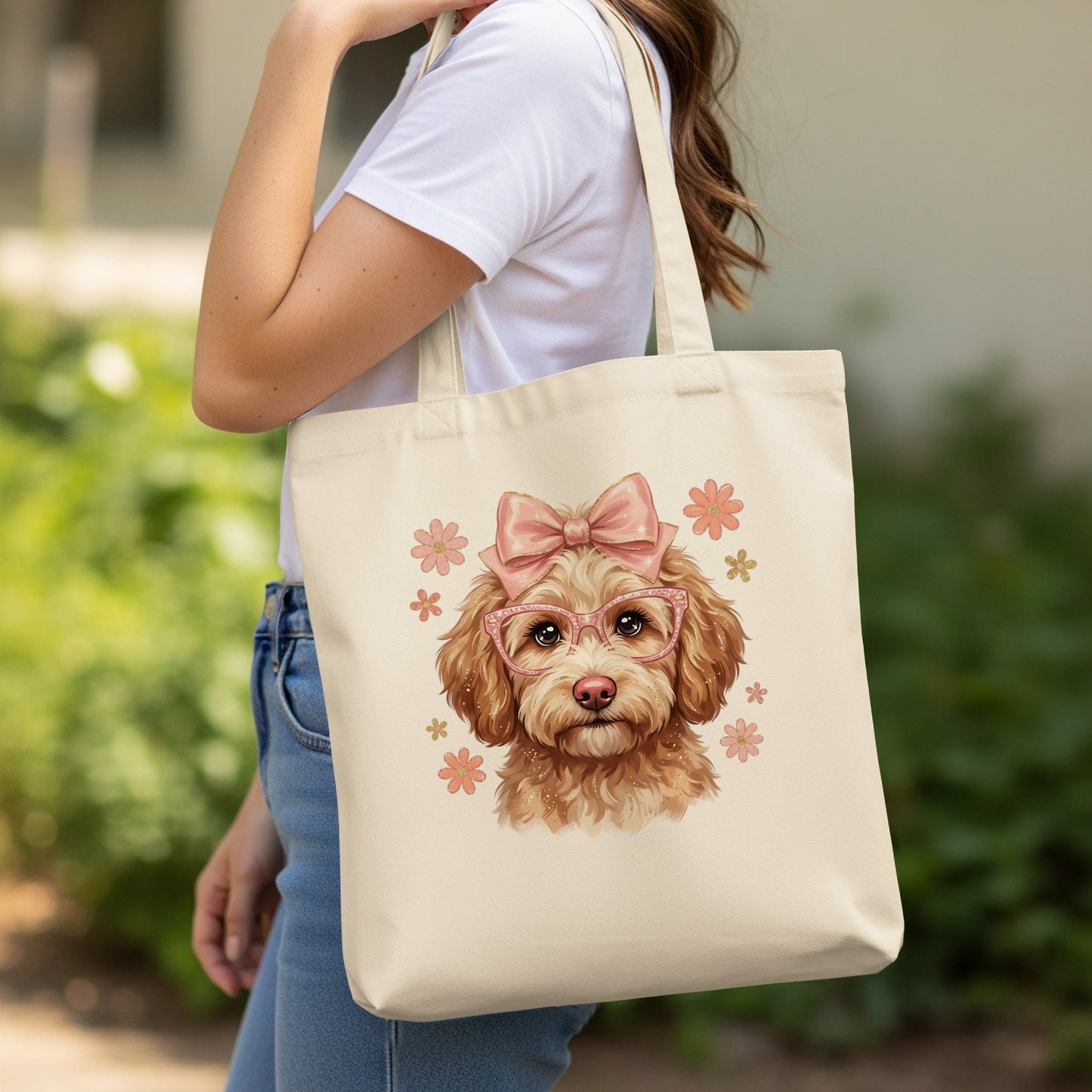 Tote bag featuring a cartoon dog wearing pink glasses and a pink bow.