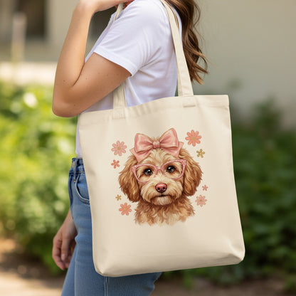 Tote bag featuring a cartoon dog wearing pink glasses and a pink bow.