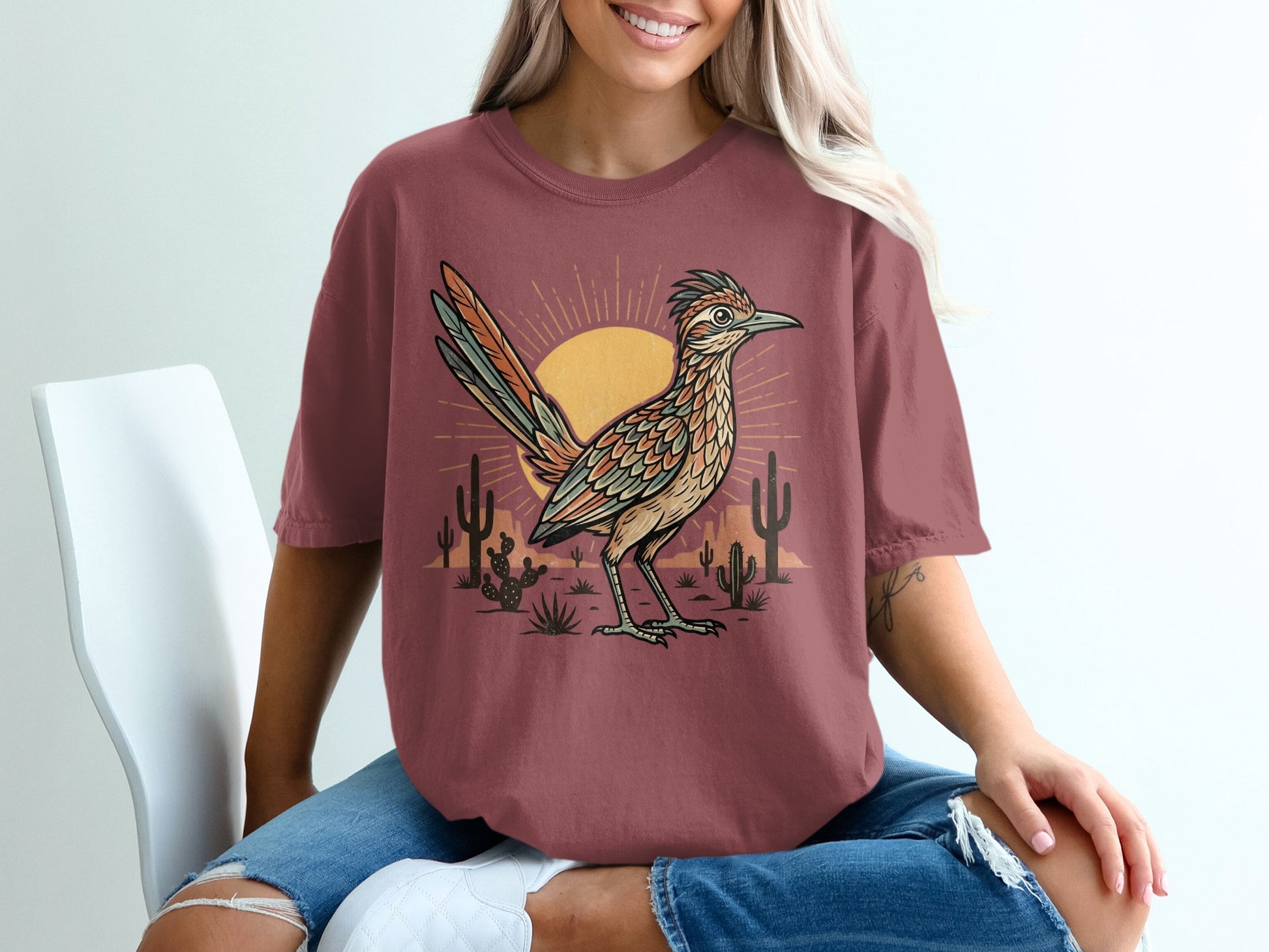 T-shirt with roadrunner and desert landscape design.