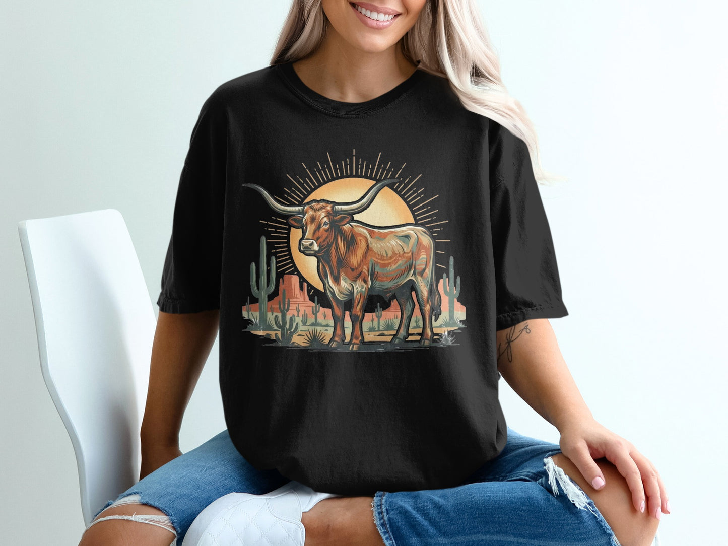 Black t-shirt with desert scene featuring a longhorn bull and cacti.