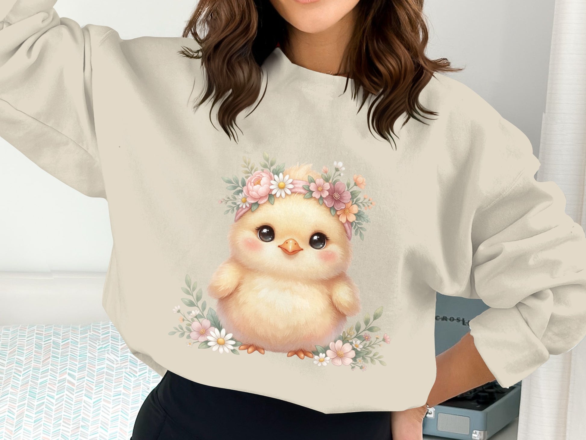 Fluffy yellow chick wearing a floral headband with pink and white flowers.