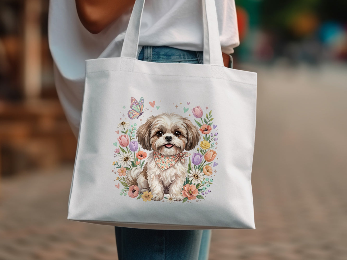White tote bag with Shih Tzu dog surrounded by colorful spring flowers and butterflies.