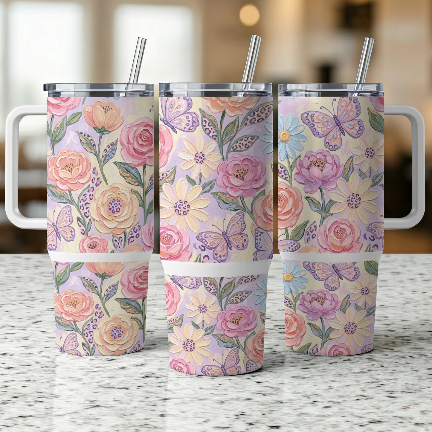Three insulated tumblers with floral and butterfly patterns.