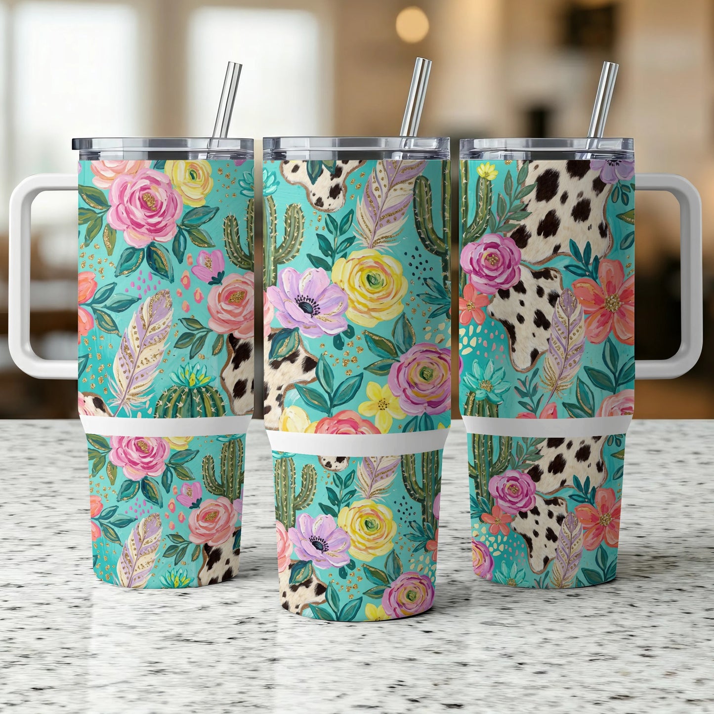 Three floral, cactus, and cow print tumblers with handles and straws.