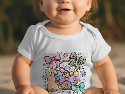 Baby in white bodysuit with Easter basket and bunny graphic.