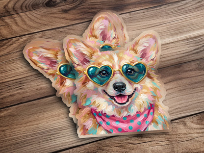 Corgi wearing heart-shaped sunglasses and a pink polka dot bandana.