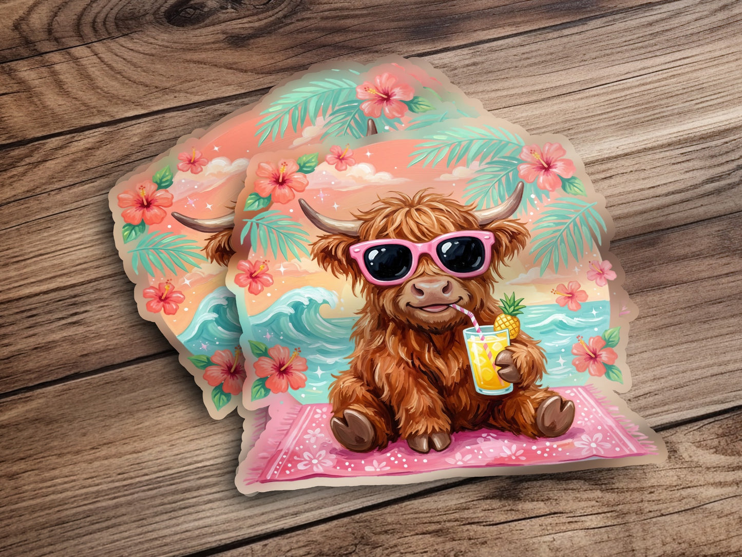 Fluffy highland cow in sunglasses drinks from a pineapple cup on a beach towel.