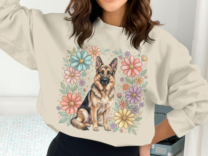 German Shepherd dog in floral wreath on cream sweatshirt.