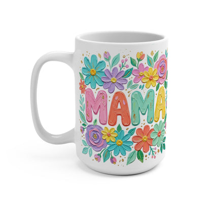 White mug with "MAMA" in colorful letters surrounded by flowers.
