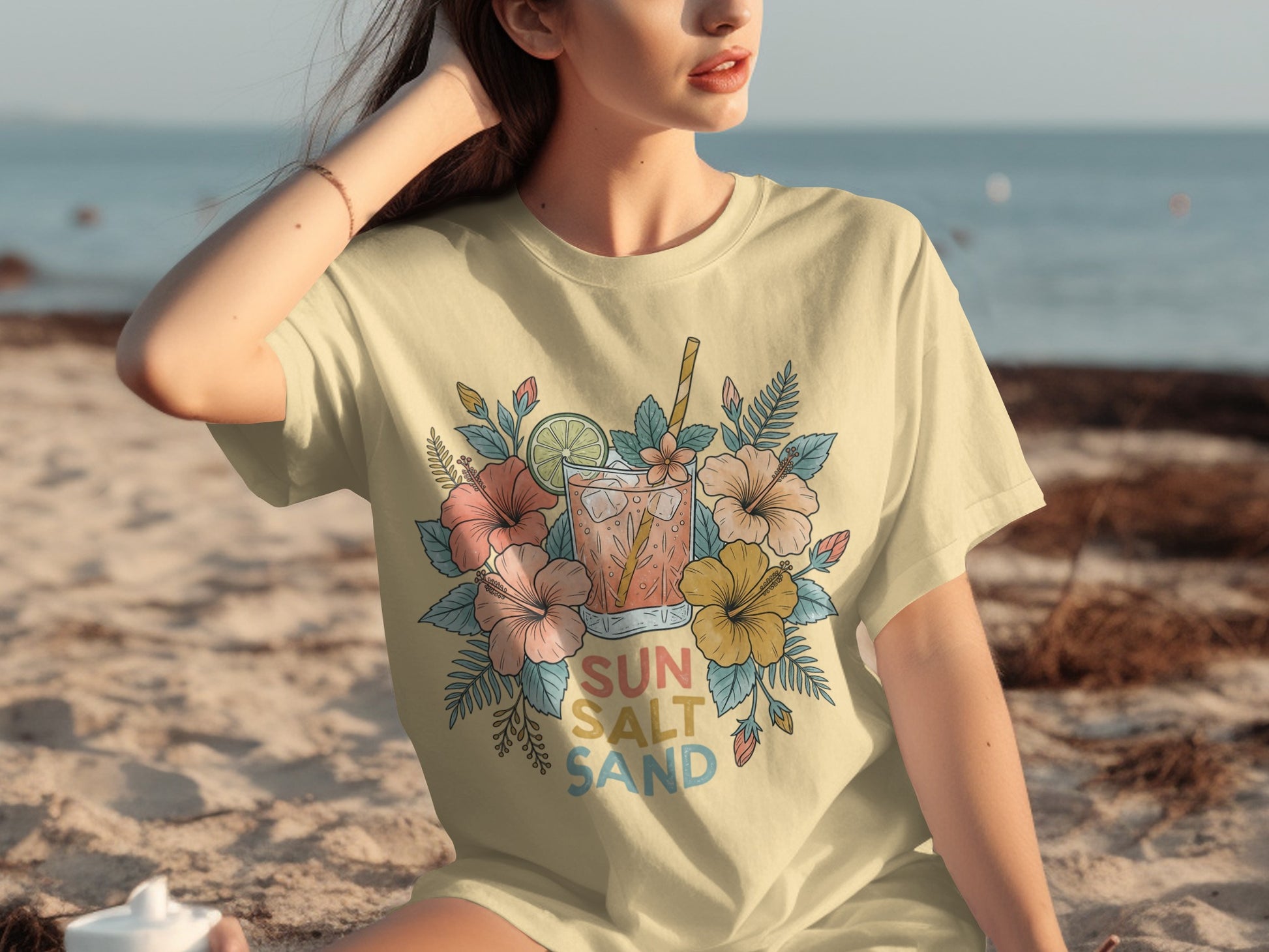 T-shirt with floral design and text "Sun Salt Sand."