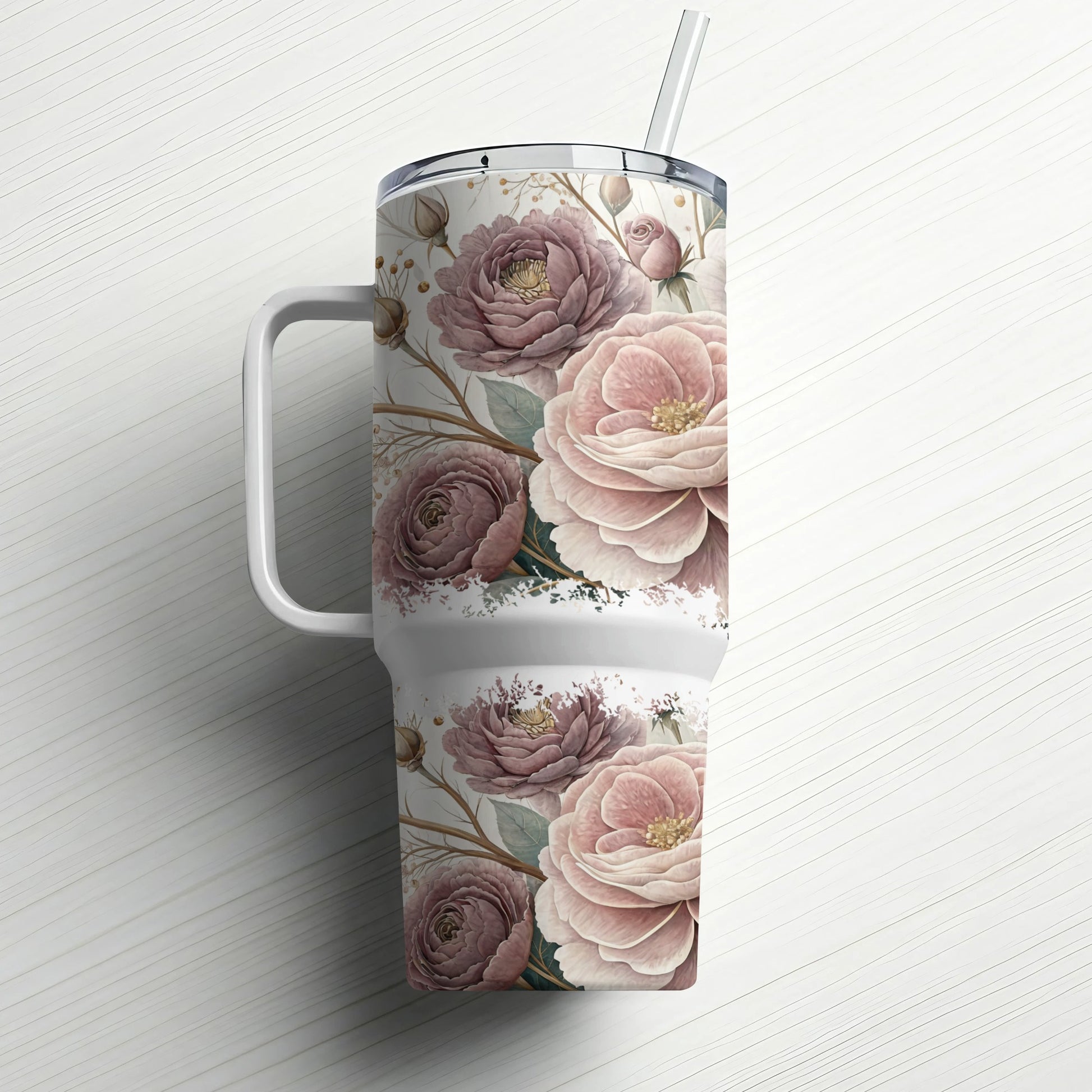 White tumbler with a muted floral pattern and a straw.