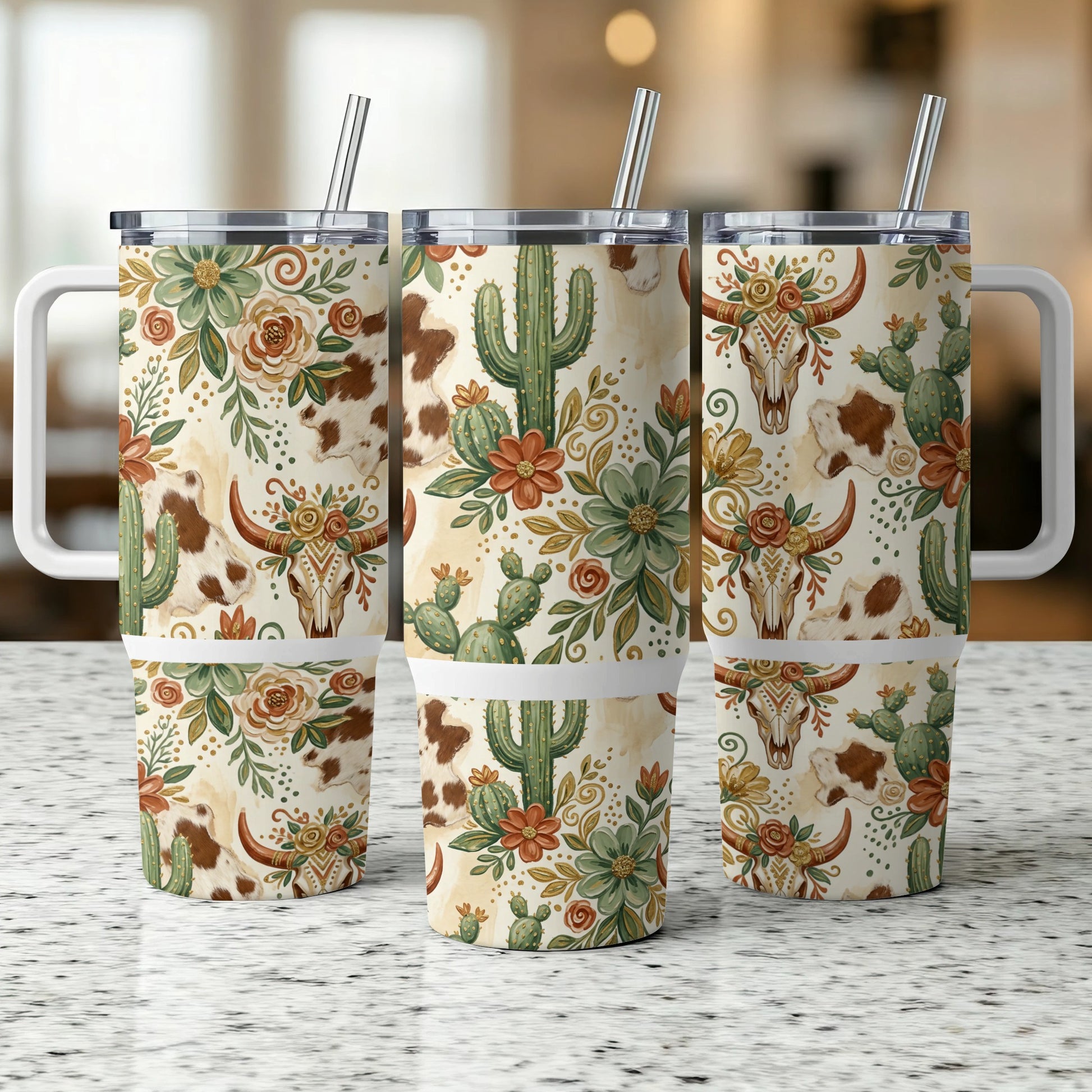 Three insulated tumblers with a western-themed floral and bull skull design.