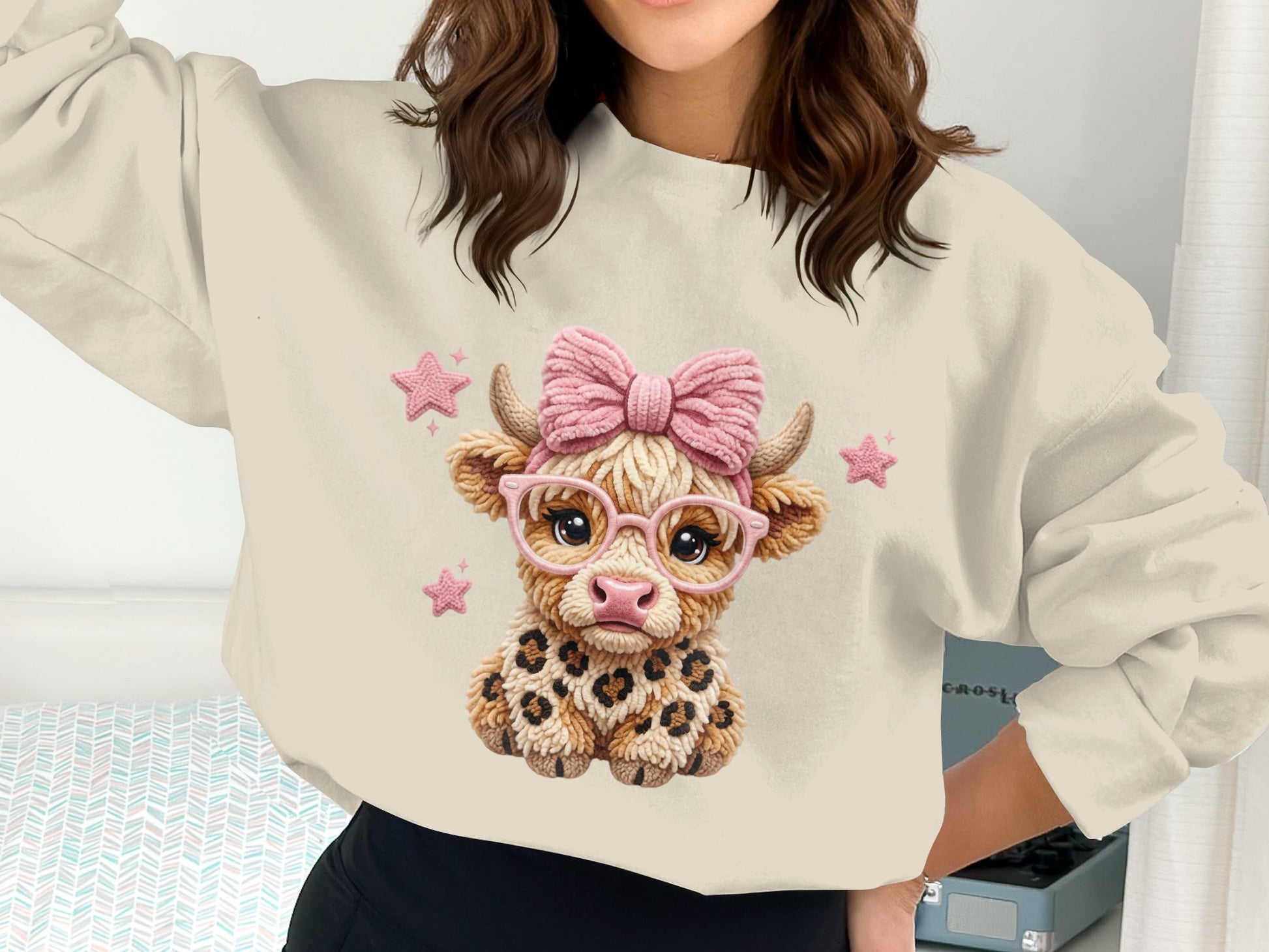 Crewneck sweatshirt with a cartoon cow wearing glasses and a bow.