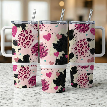 Three patterned tumblers with leopard print, hearts, and cow print accents.
