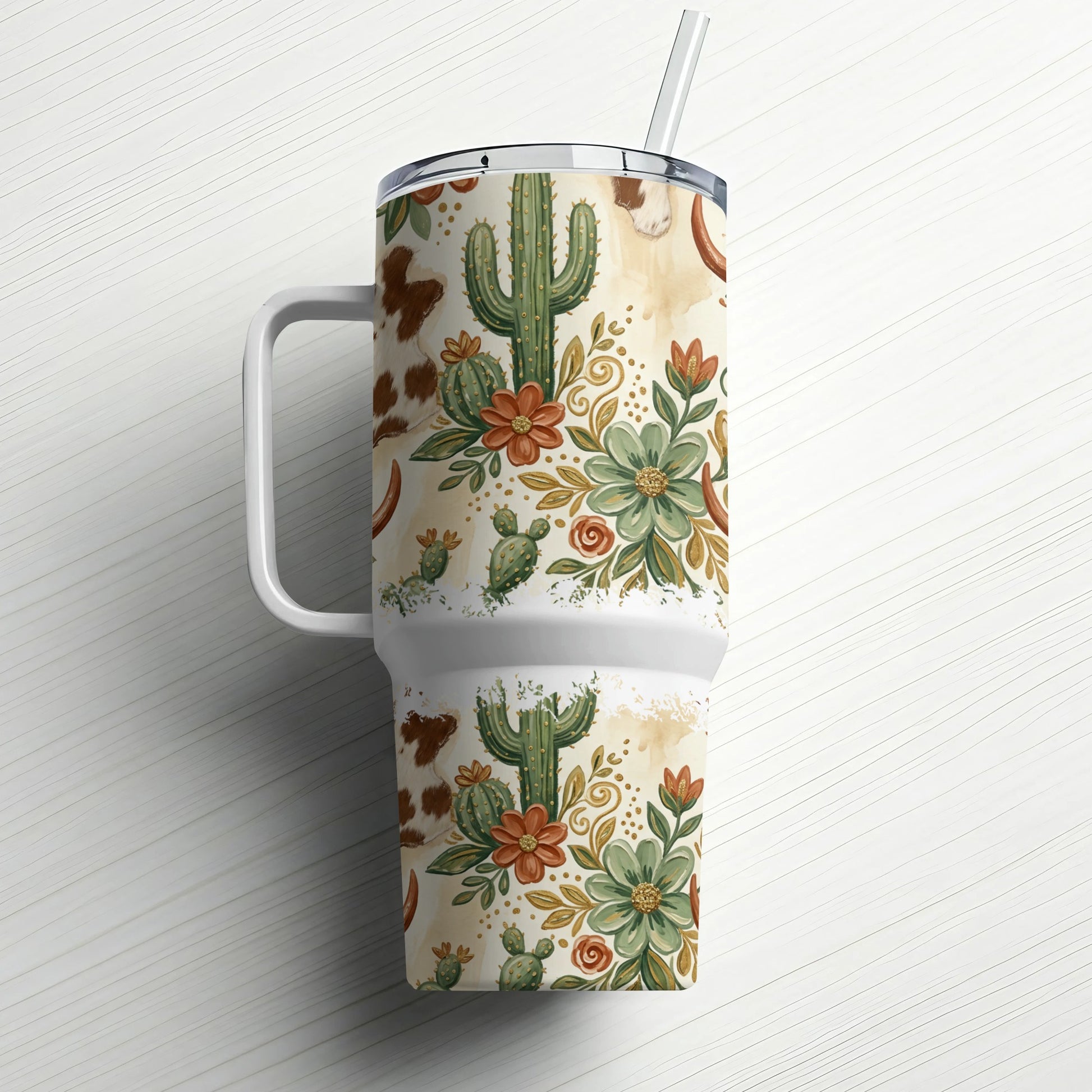 White tumbler with western cactus and floral pattern, featuring a straw.