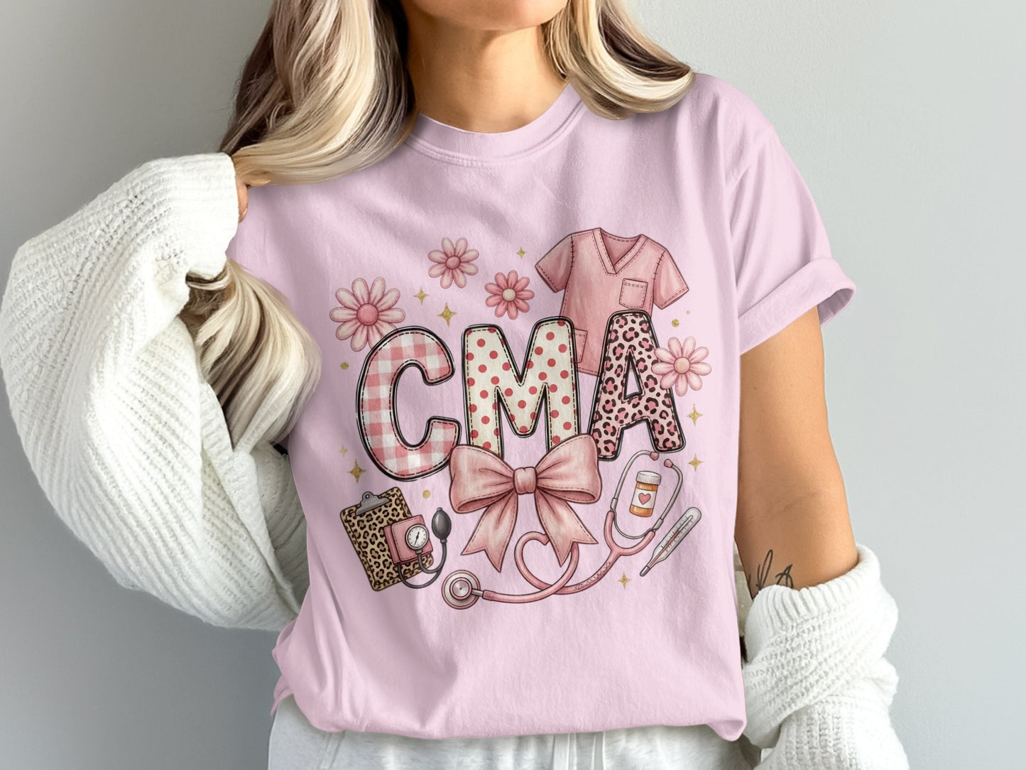 Pink t-shirt with "CMA" in patterned letters and medical icons.