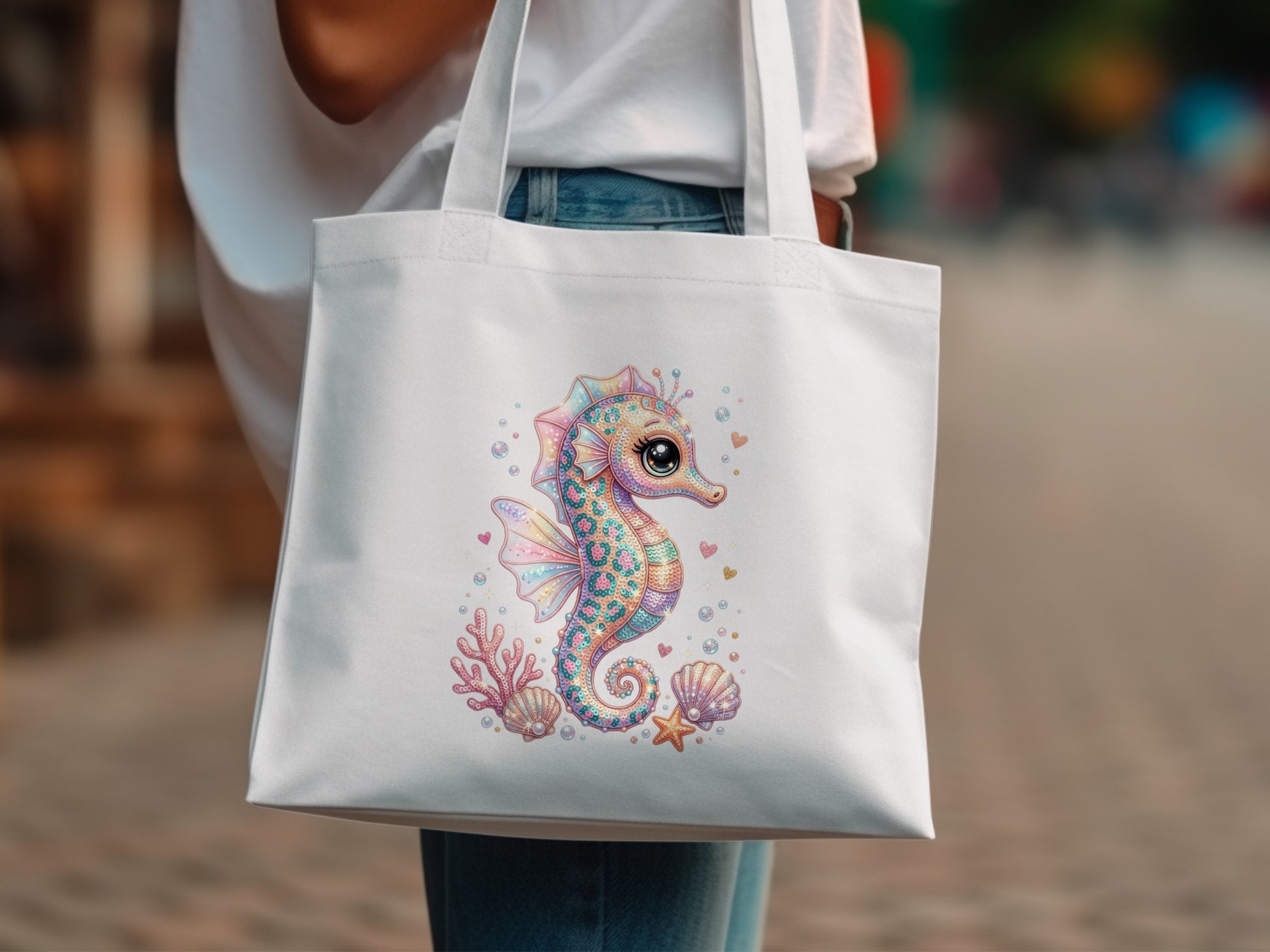 White tote bag with a colorful seahorse, coral, and seashells design.