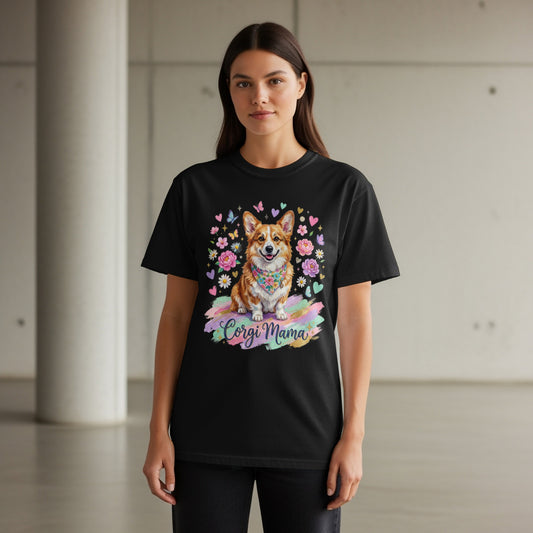 Black t-shirt with a colorful illustration of a corgi wearing a bandana and surrounded by flowers and butterflies.