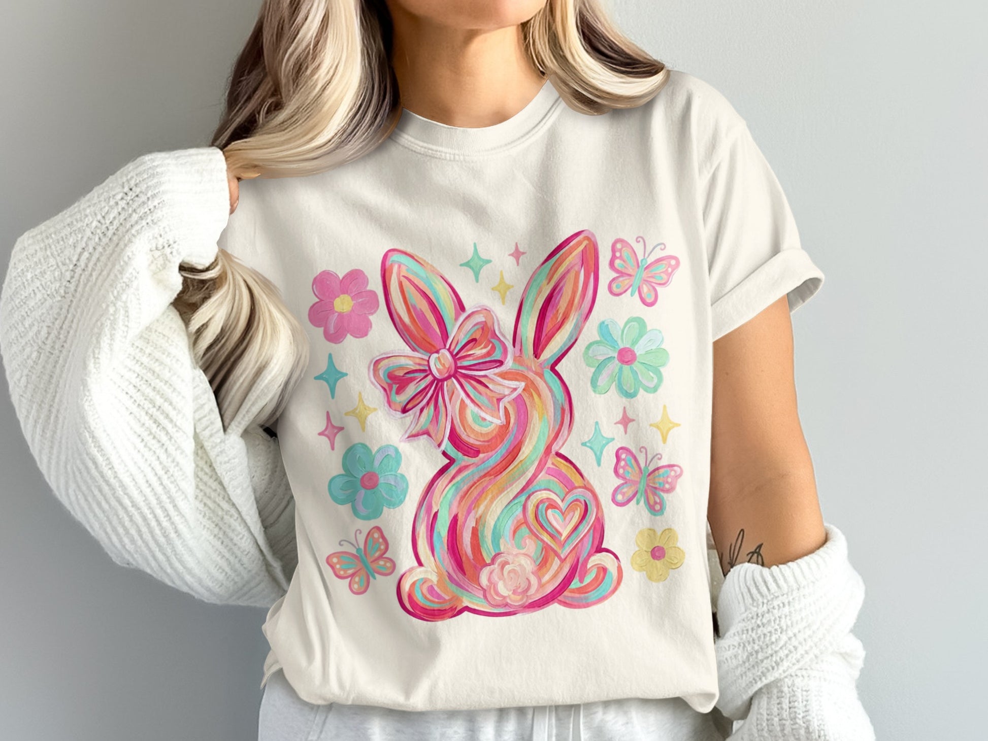 Easter bunny with bow, heart, flowers, and butterflies.
