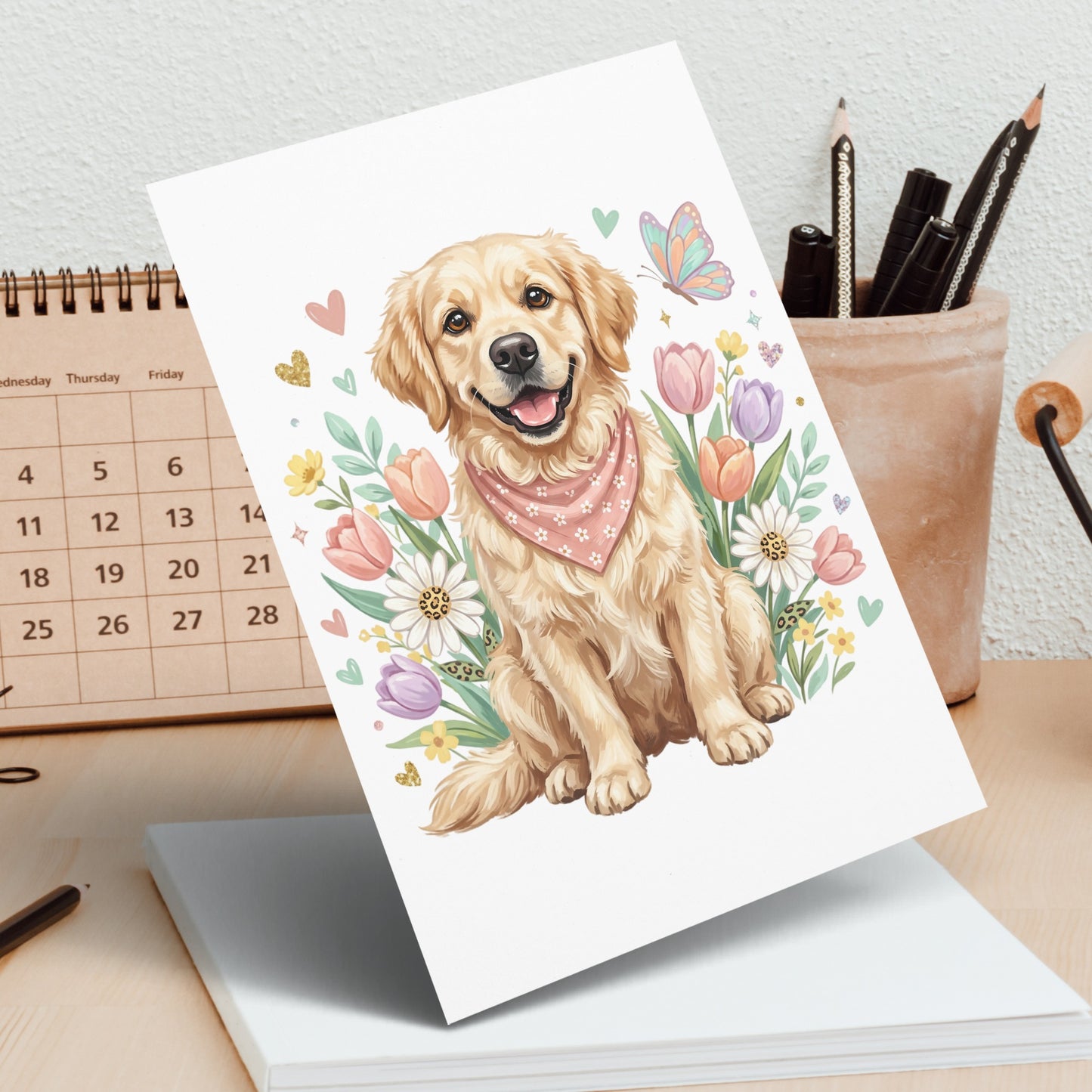 Golden retriever puppy wearing bandana, surrounded by flowers and a butterfly.