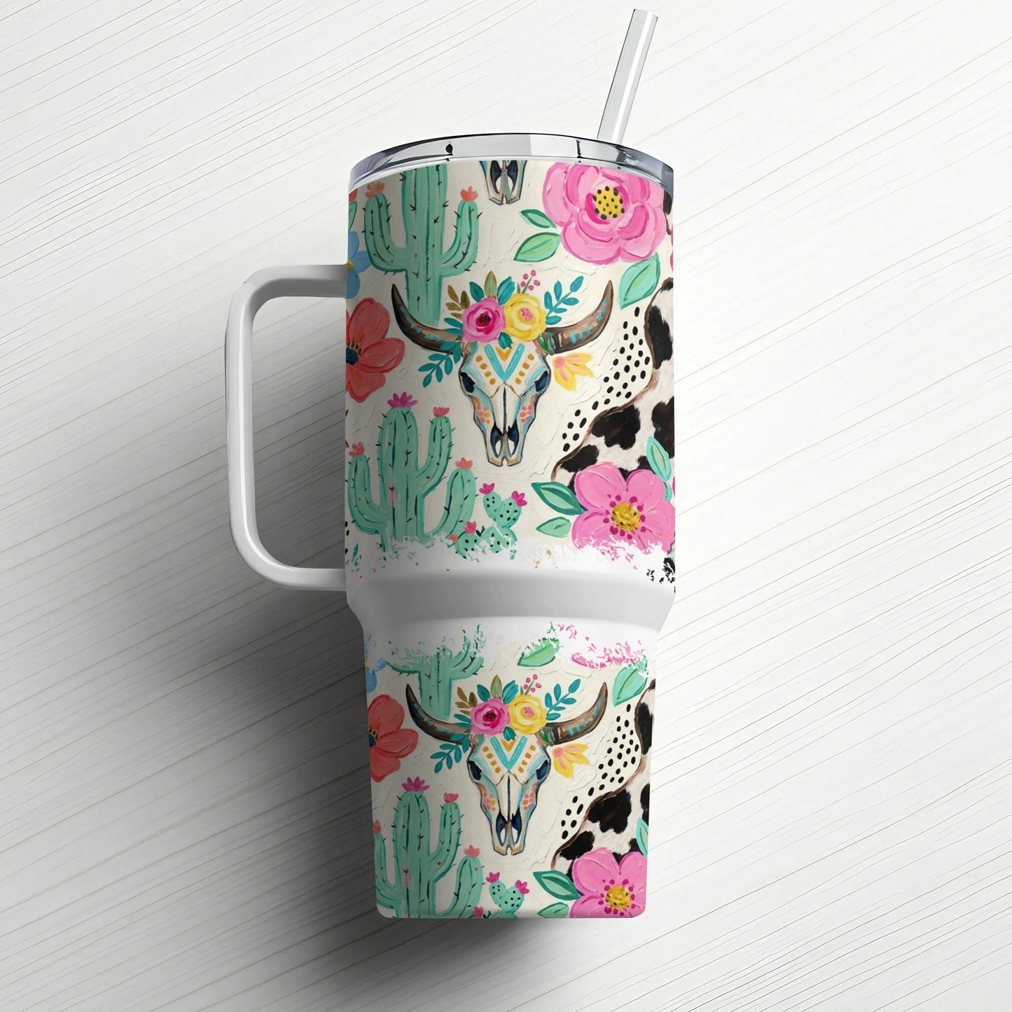 Tumbler with skull, cactus, and floral western-themed pattern.